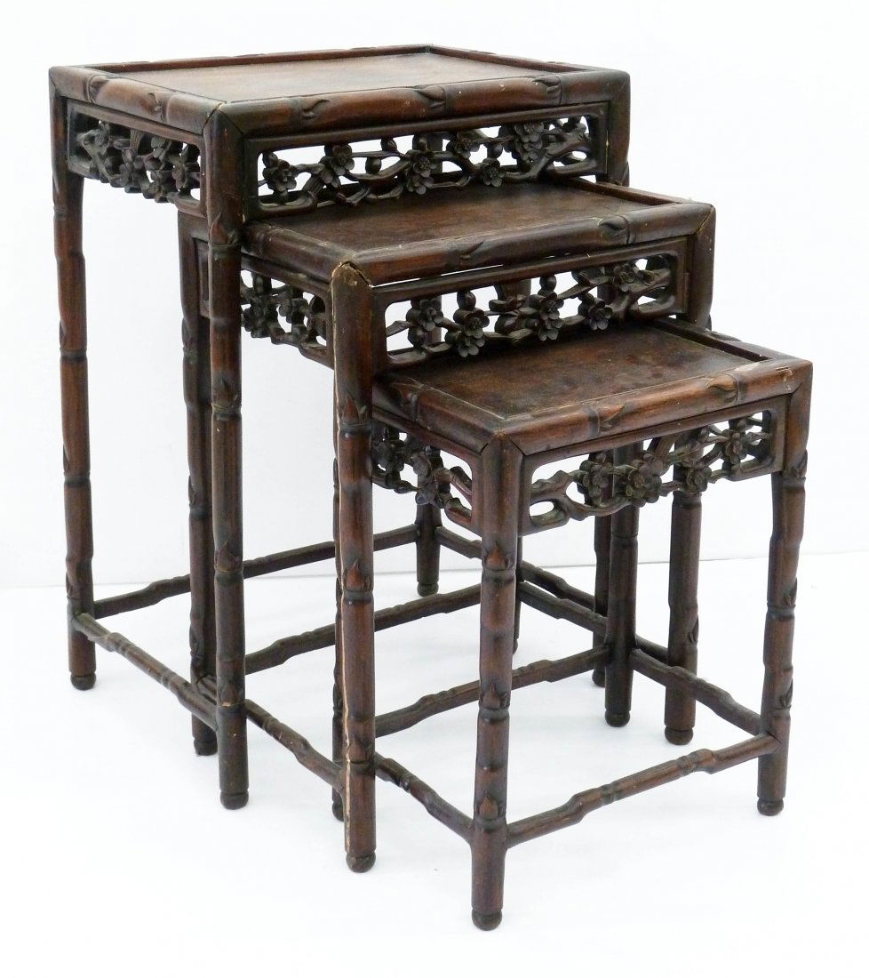 Antique Chinese Rosewood Nesting Tables: Antique Chinese Rosewood Nesting Tables 24''x17.5''x12.5''. A three piece pierced carved set with prunus flower motif. Overall wear from use. 19th century, Qing dynasty.
