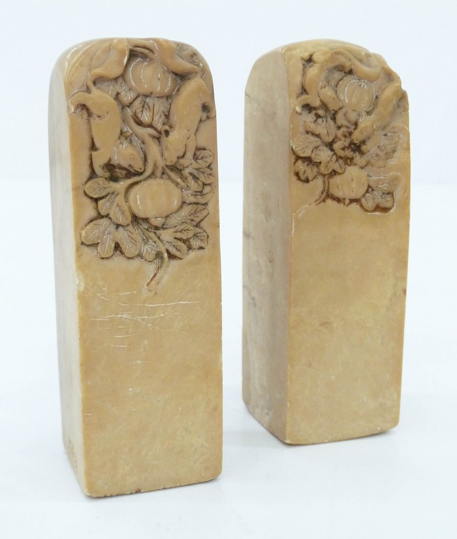 Pair Antique Chinese Carved Soapstone Seals 4''x1.5'': Pair Antique Chinese Carved Soapstone Seals 4''x1.5'' Each. They have relief carved scenes of twin rats with squash. Each has a carved four character chop seal on bottom. Slight overall wear. 19th cen