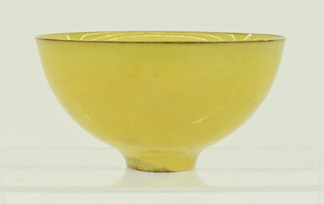 Gertrud & Otto Natzler (20th Cent. California) Yellow: Gertrud & Otto Natzler (20th Cent. California) Yellow Glazed Ceramic Bowl 3.5''x6.75''. Refined wheel thrown form with dripping canary yellow glaze. Signed on bottom with inventory number. Slight .75'