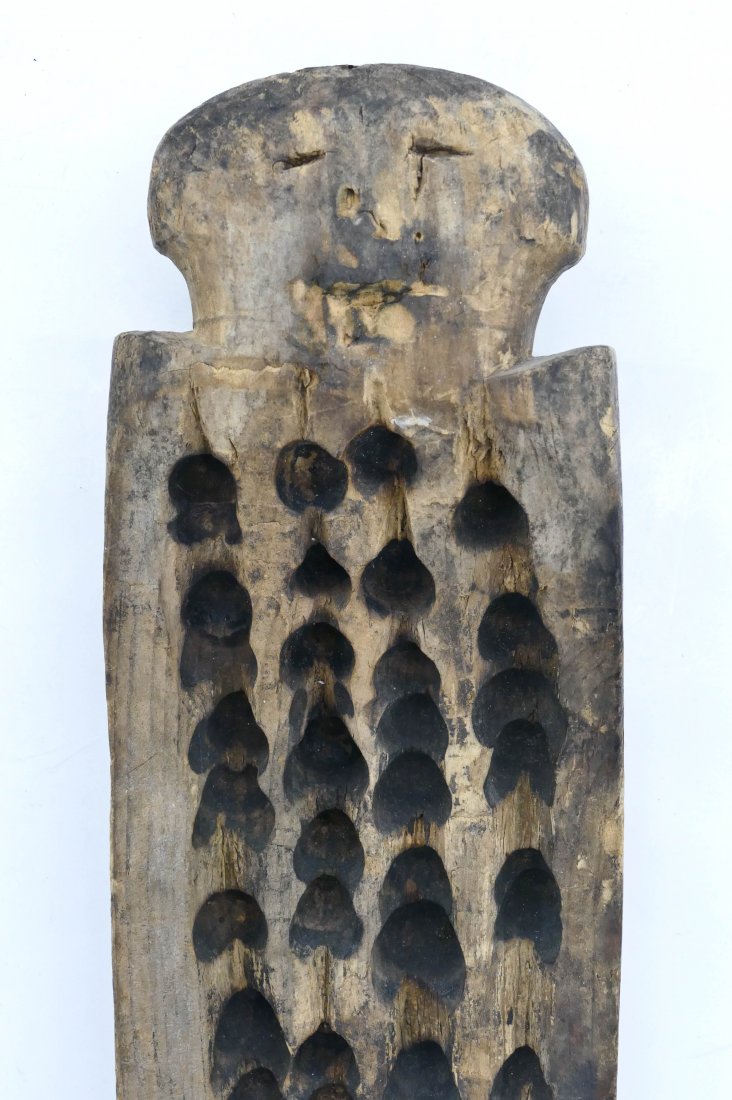 Antique Siberian Eskimo Koryak Fire Board 16''x4.5''. A: Antique Siberian Eskimo Koryak Fire Board 16''x4.5''. A carved and burned wood spiritual board with human effigy. A ceremonial artifact. Overall wear from use.