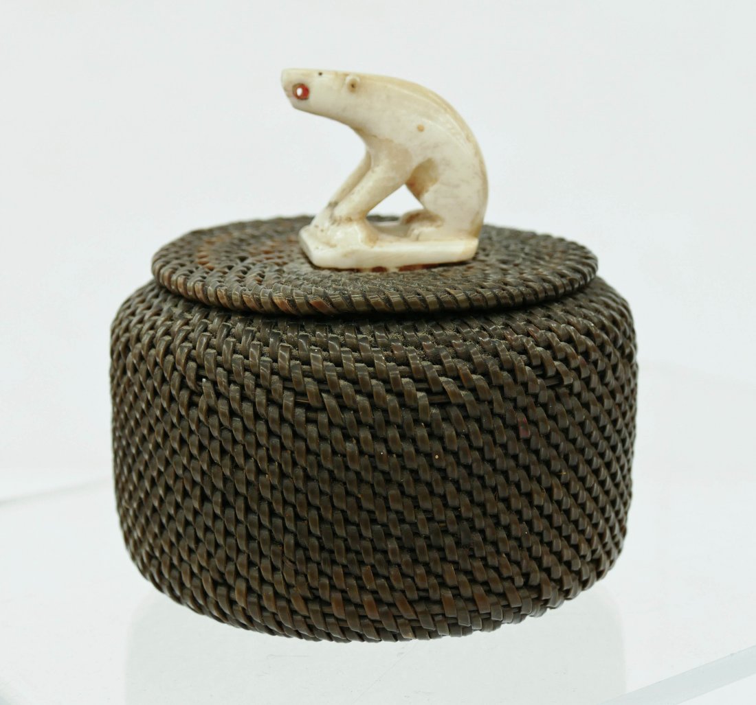 Old James Omnik Baleen Basket 3.75''x3.75''. An early: Old James Omnik Baleen Basket 3.75''x3.75''. An early native basket by this well known Alaskan Eskimo artist. Carved ivory bear with seal finial. Signed on interior ''206 Omnik Pt. Hope Alaska''. Exce