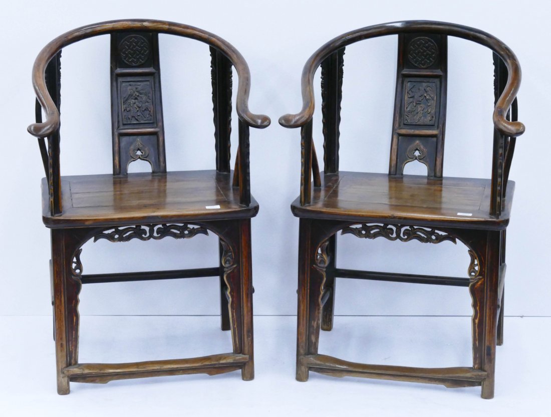 Pair of Chinese Horseshoe Elm Wood Chairs: Pair of Chinese Horseshoe Elm Wood Chairs 38''x25.5''x23'' Each. Antique armchairs with relief carved back panel and decorated legs. 18th century, Qing dynasty.