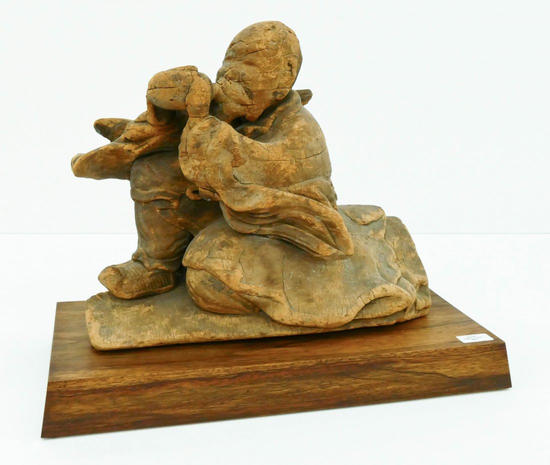 Early Japanese Wood Temple Figure on Stand 15.5''x20''.: Early Japanese Wood Temple Figure on Stand 15.5''x20''. Carved wood seated figure on hardwood base. Overall wear from age. 17th century, Edo period.