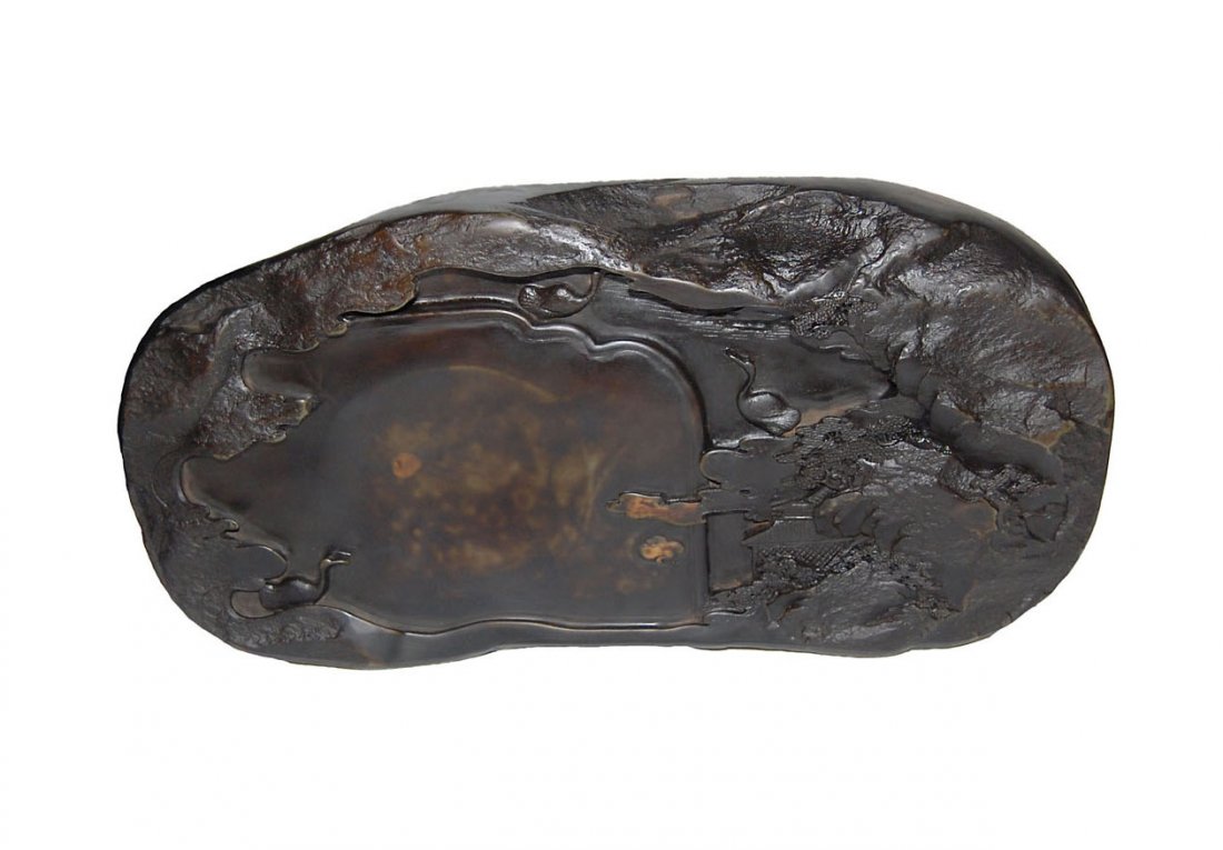 A Well Carved Duan Inkstone with Landscape Scene: 浮雕山水祥雲端硯 A Well Carved Duan Inkstone with Landscape Scene Height: 2⅝ in. (6.7 cm.), Length: 15½ in. (39.4 cm.)