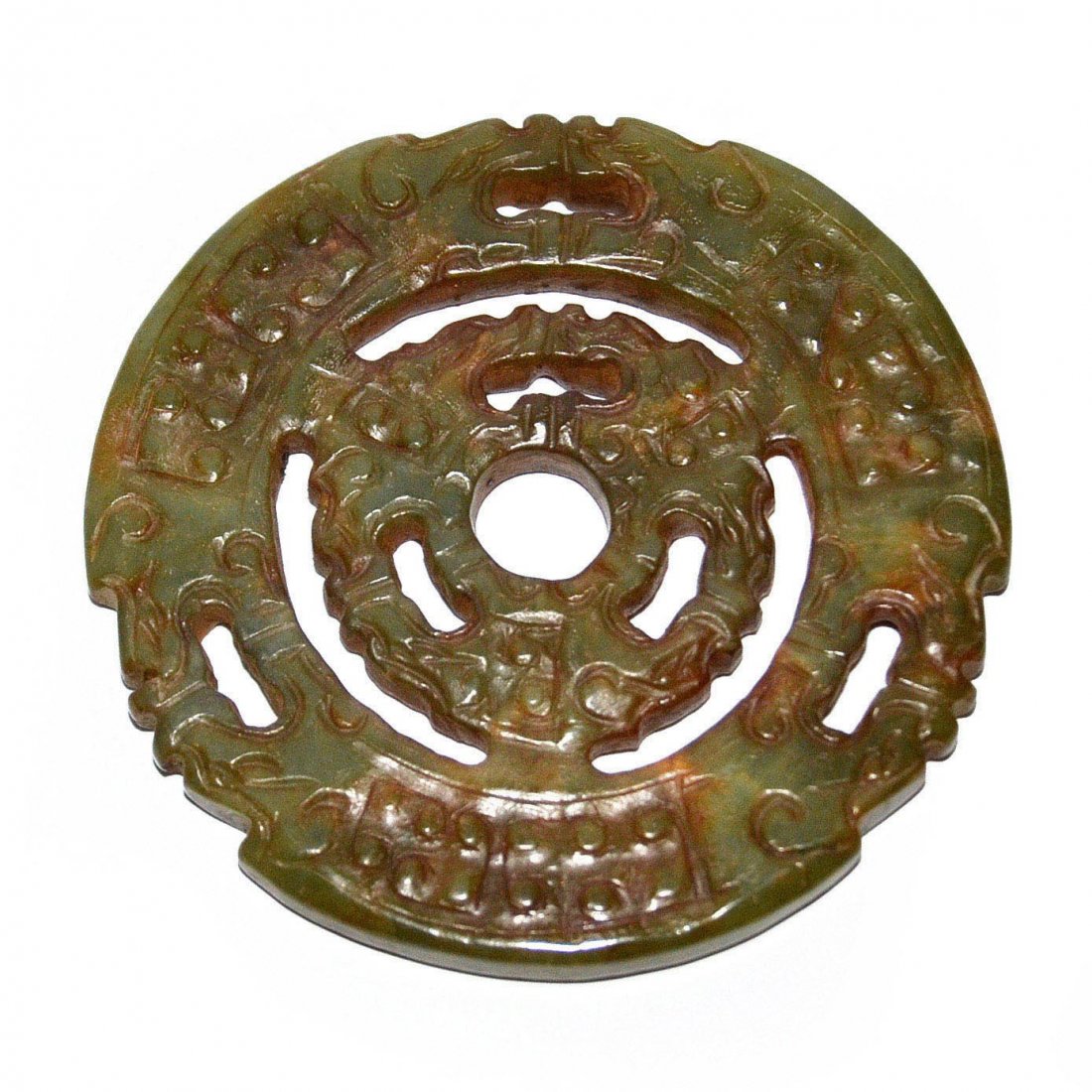 Shang Dynasty, Jade Bi with Openwork Dragon Design: 商 龍璜鏤雕玉璧 Shang Dynasty, Jade Bi with Openwork Dragon Design Diameter: 3⅝ in (9.2 cm)