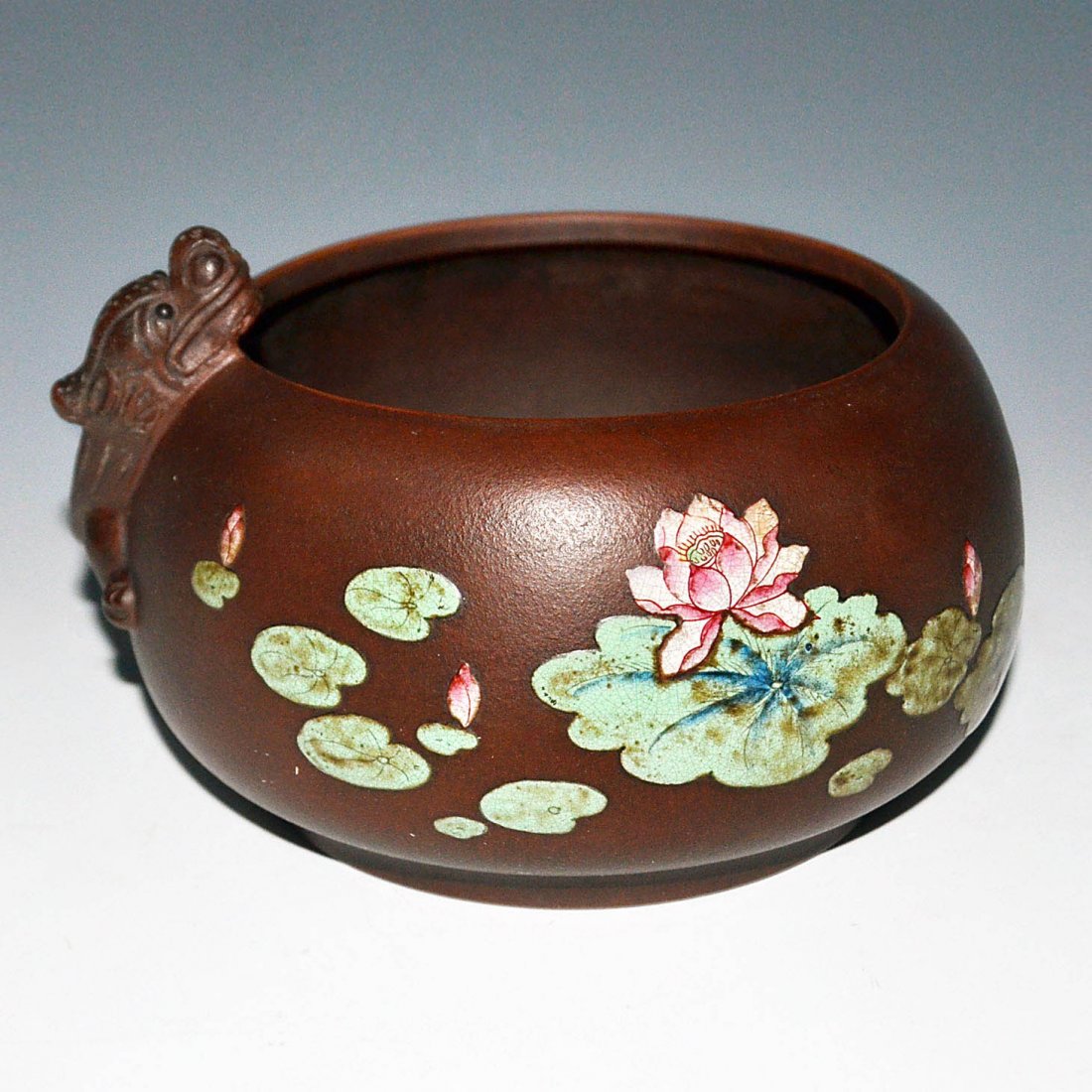 A Zisha Washer Polychrome Painted Lotus Pond Scene with: 紫砂塑雕螭龍彩繪荷池水洗 A Zisha Washer Polychrome Painted Lotus Pond Scene with an Applied Qilin on the Side Height: 4⅝ i