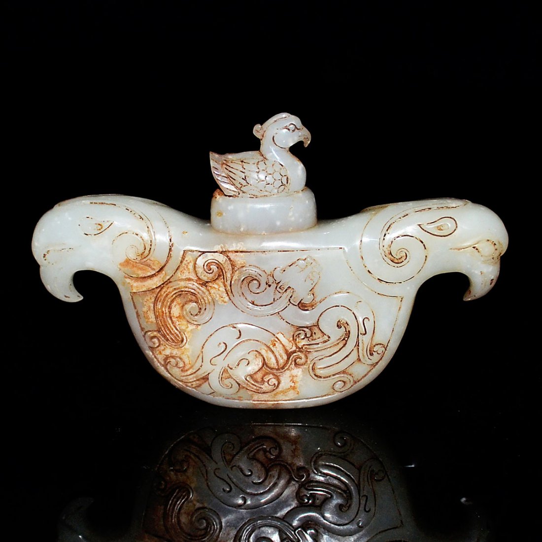 Archaistic Jade Zun Carving of Twin-Link Birds with: 古白玉雕雙鳥連體蓋尊 Archaistic Jade Zun Carving of Twin-Link Birds with Cover Carved in low relief with scroll design a conjoined bird with