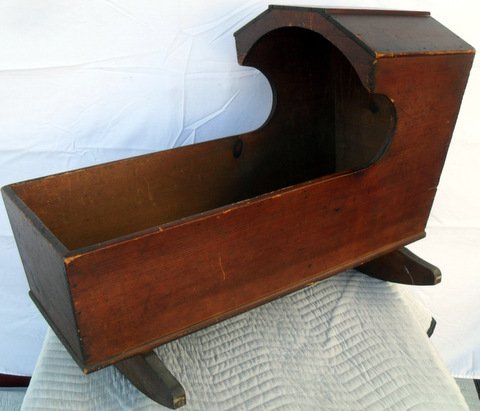New England Hooded Rocking Cradle: New England Pine Hooded Rocking Cradle Pine construction, hardwood rockers and covered wagon style hood. 34" long