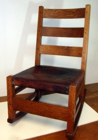 Gustave Stickley Nursing Rocker: Rare Gustave Stickley Mission Nursing Rocker Horizontal slat back with mortisee and pin construction and stretcher base. Original Moroccan leather seat with label underside. Stickley brand mark on str