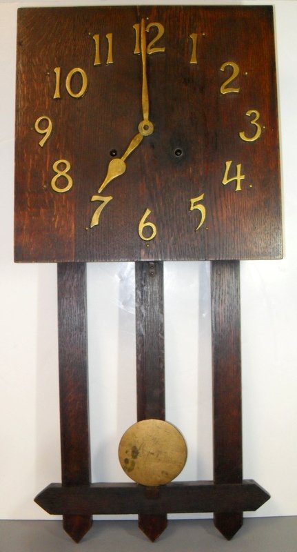 Ingraham Mission Hanging Wall Clock: Arts& Crafts Ingraham Mission Oak Hanging Wall Clock Square heavy oak face, brass Arabic numerals. 28" long x 13" wide. Impressed Ingraham on back. Key & pendulum included.