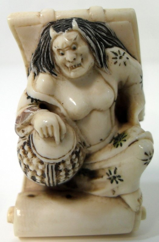 Artist Signed Ivory Polychrome Netsuke: Polychrome seated devil figure with drum. 2 1/8" tall x 1 1/4" wide
