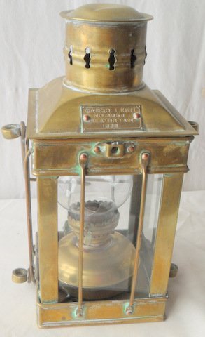 English Brass Ship's Cargo Light #3954: English Brass Ship's Lantern Cargo Light #3954 Brass frame with glazed sides enclosing kerosene font with burner, bail handle with pierced circular smoke stack (retains plaque). Cargo Light #2954 Grea
