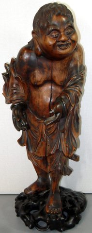 Chinese Wood Carving Happy Peasant: Monumental Chinese Hardwood Carving of Happy Peasant Detailed carving of Chinese peasant on carved hard wood reticulated base. Detailed facial, ivory eyes and flowing robes. Measures 17" tall x 6 1/2"