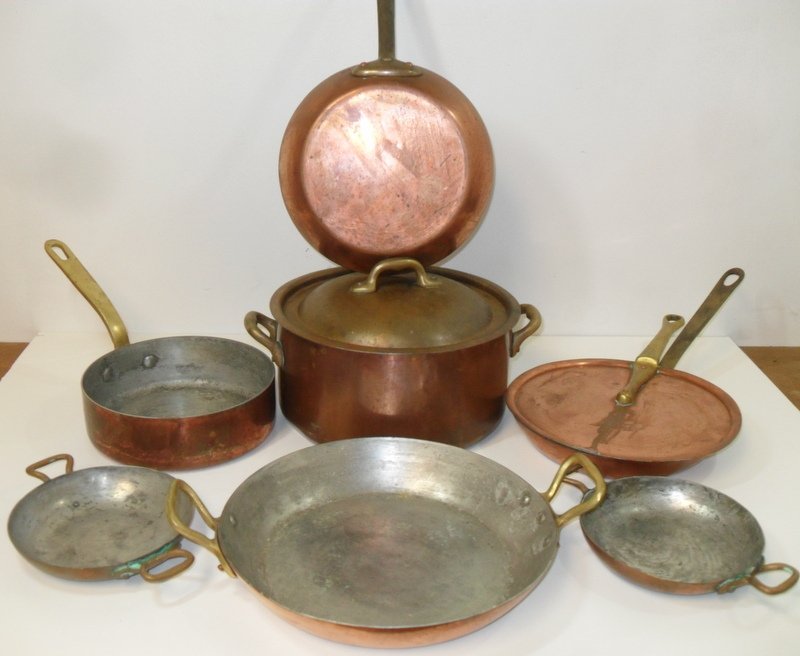 7 Pcs Antique French Copper Cookware: 7 Pieces of Antique French Copper Cookware 9" double handled sauté pan, 7 1/2" diameter small frying pan, two 5" double handled pans, 6 1/2" open pot, 8" diameter covered pot and a 7 1/2" covered fry