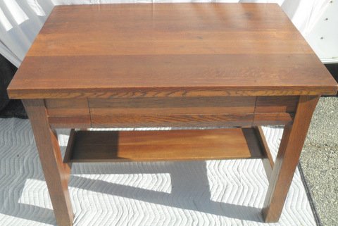 Mission Stickley Style Oak Library Desk: Oak construction, medial center shelf and stretcher foot rest. 42" x 28" x 30" tall. Signed Imperial
