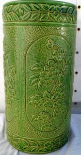 Arts & Crafts Carved Majolica Umbrella Stand: Concentric panelled floral design on stippled ground surface, leaf and floral borders. 1920s era. 18" tall x 9 1/2" diameter
