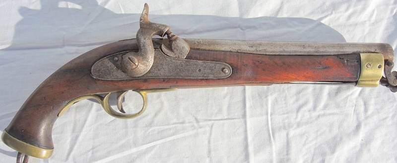 19th Century English Percussion Riding Pistol Lacy & Co: Heavy walnut stock brass furniture, working percussion mechanism, 58 cal. Circa 1800. 16" long