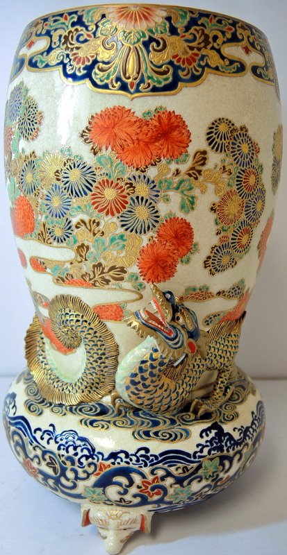 Satsuma 19th Century Imperial Dragon Vase: 19th Century Satsuma Imperial Dragon earthenware vase with high relief dragon. Weighted foo dog supported bulbous circular vase ascending to tapered cylindrical vase. Has three dimensional highly enam