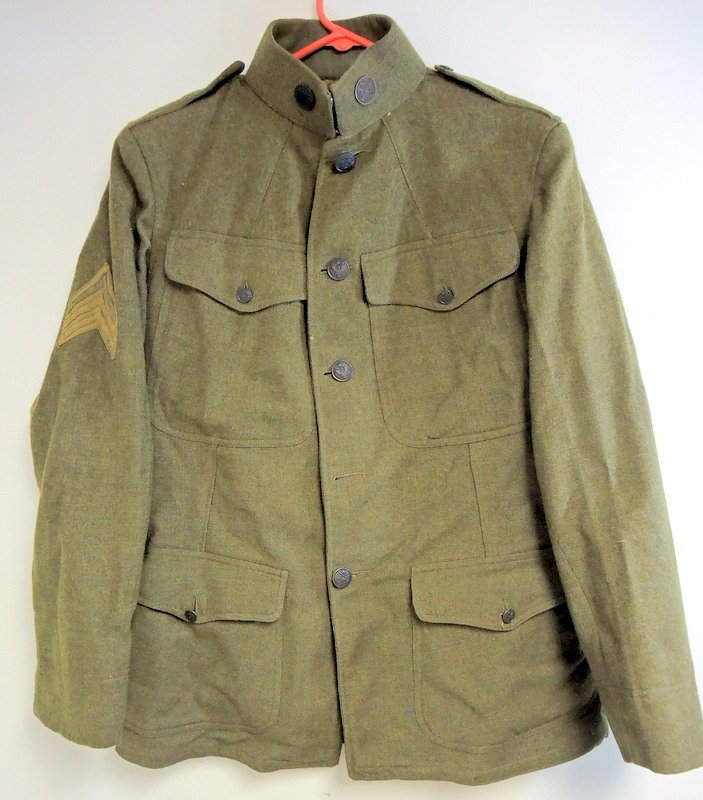 Authentic WWI American "Dough Boys" Uniforms: Two summer and winter WWI uniforms includes tunic tops, leggings and pants. Estimated at sizer 36 or 38. We believe the buttons indicate a member of the Quartermaster's Corps and a rank of seargent.