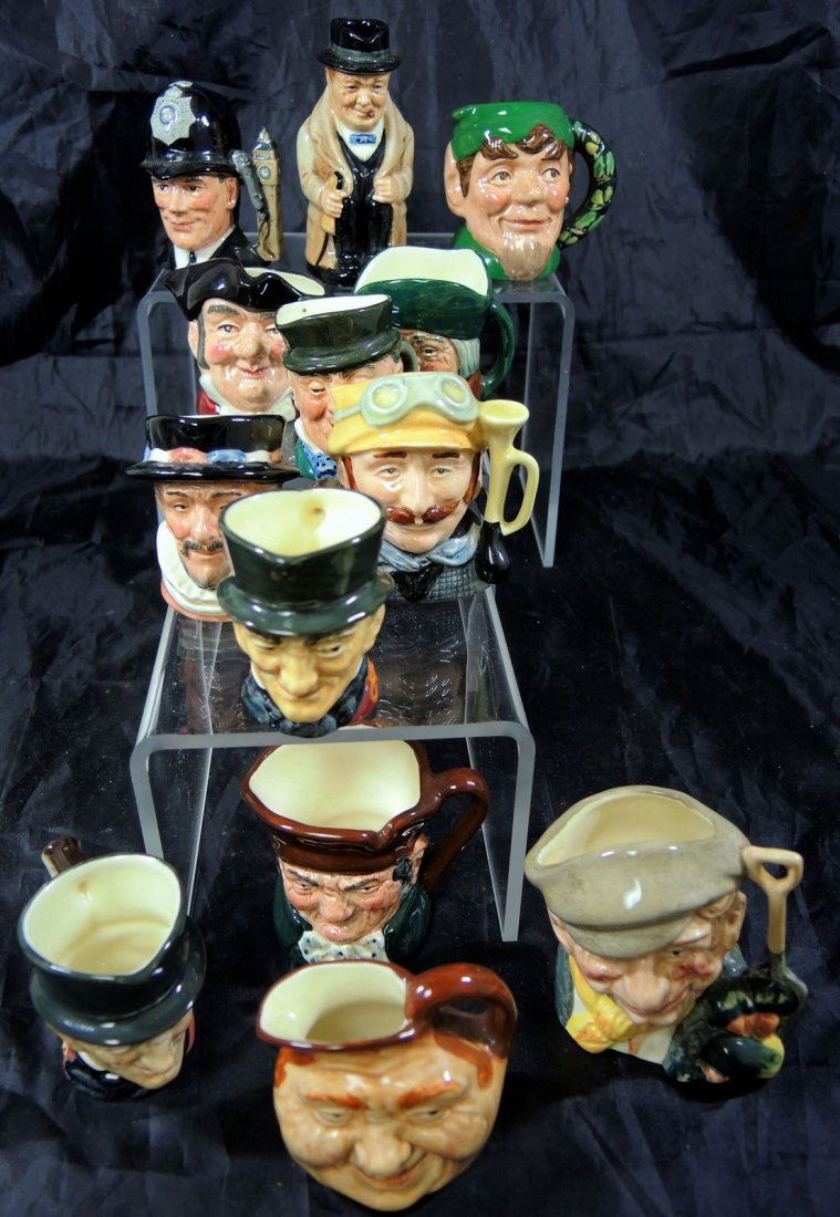 Lot of 13 Miniature Royal Doulton Character Jugs: English characters to include: Winston Churchill, Old Charley, Mr. Micawber, (2) John Peel, Toby Philpots, Mine Host, London Bobby, John Barleycorn, Beefeater, The Gardener, Veteran Memorial, Elf. 2 1