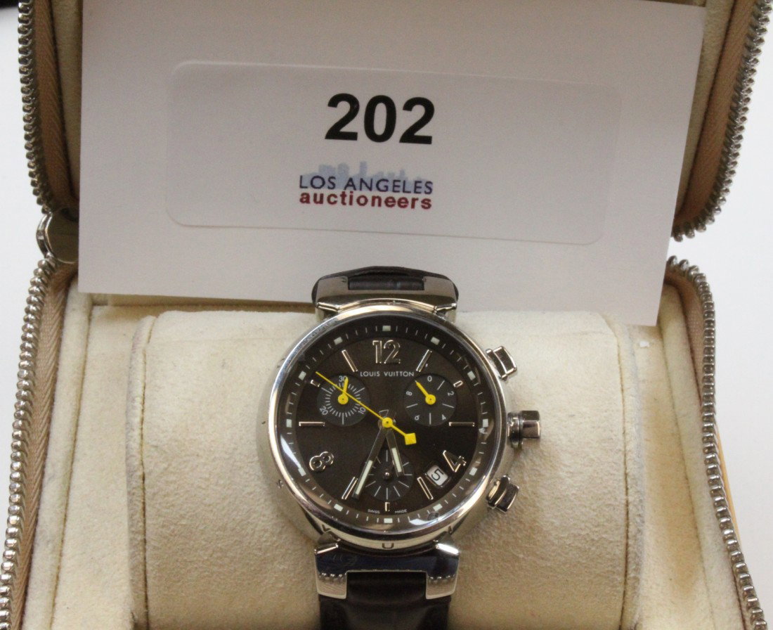 Louis Vuitton Tambor Men's wristwatch: Authentic Louis Vuitton tambor men's wristwatch, made in France. Authentic Alligator skin strap, dark brown three stop and date time watch face. Comes in original box