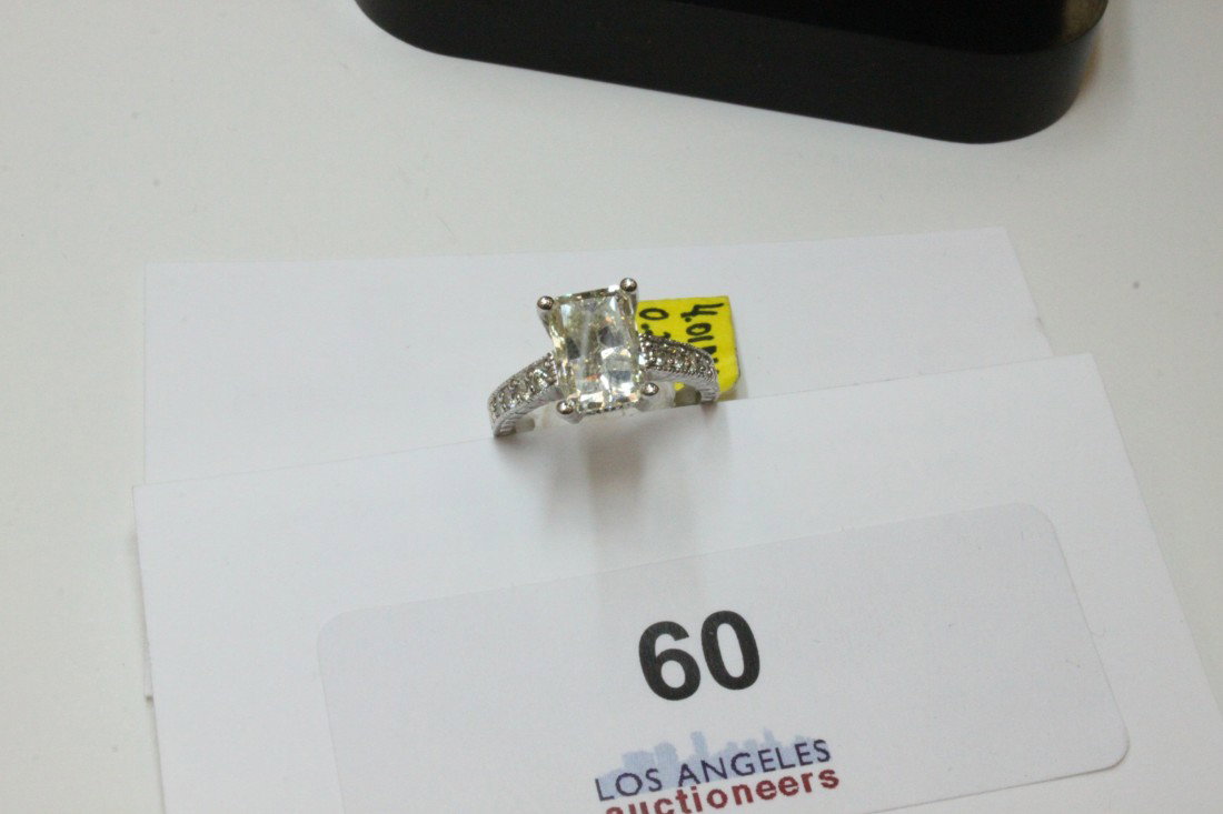 Solitaire DIA Ring: UGS certified DIA 4.01 carat with 14K white gold band DIA 0.29 carat. Center stone emerald cut SI1 K-L color. Estimate retail value $42, 930