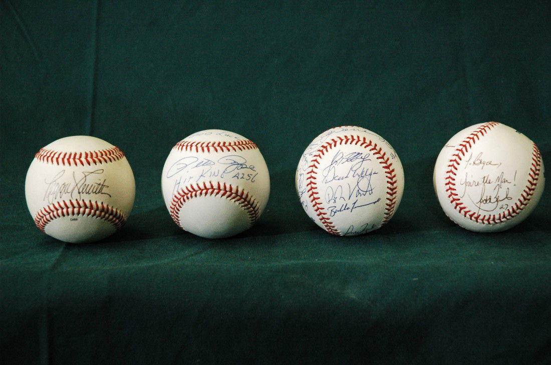 Set of 4 Autographed Baseballs: Signed by "The Hit King" Pete Rose, Reggie Smith and multiple others. One baseball signed by the 2003 Mets team.