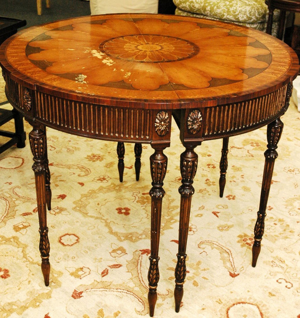 Mahogany Table: Beautiful mahogany entrance table, eight legged. Minimal scratches on surface. Can be split into two half tables if desired. 36" height x 40" diameter by Premier Furniture Crafters signed E.F. Victor