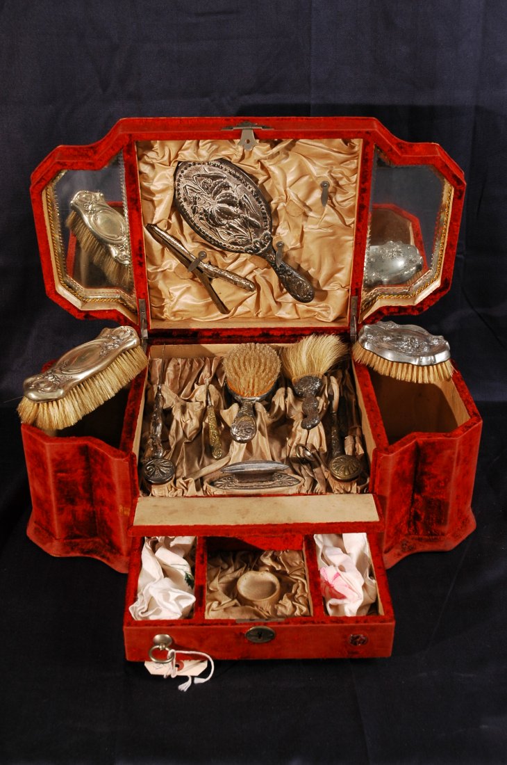 Antique French Ladies Dressing Kit with Velvet Carry: Antique French dressing kit encased in red velvet carrying case. 13 pieces includes brush, mirror, perfume jar, filer, and more. 20" x 12" x 11".