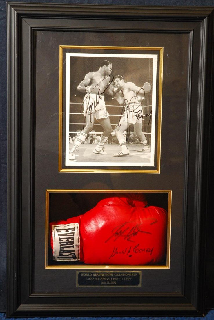 Larry Holmes And Gerry Cooney DUAL SIGNED memorabili: Larry Holmes and Gerry Cooney DUAL SIGNED World Heavyweight Championship title action shot 8" x 10" photo and boxing globe, in a shadow box display. Dimensions 28.5" H x 18"W x 9"D