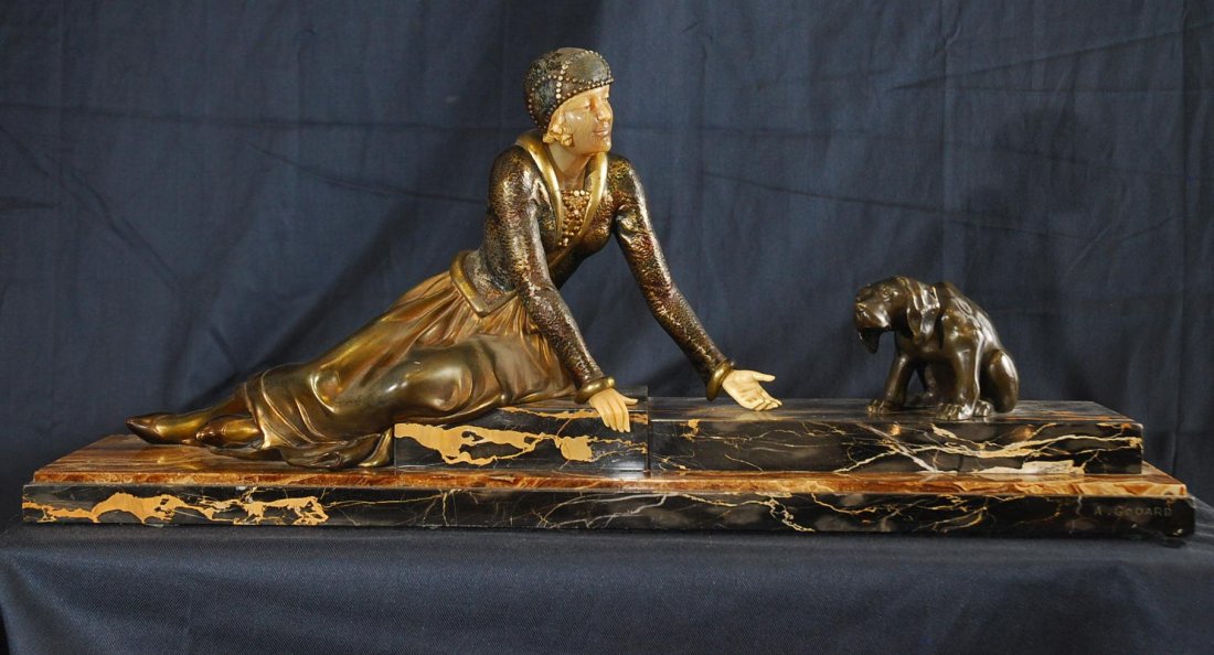 Arman Godard (19th/ 20th Century) European: WOMAN WITH DOG, cast bronze and ivory sculpture, signature in marble base, 11” tall, 7” deep, 29” wide including stylized 1 ½” tall base, ivory darkened, bronze with some loss of patina, wear