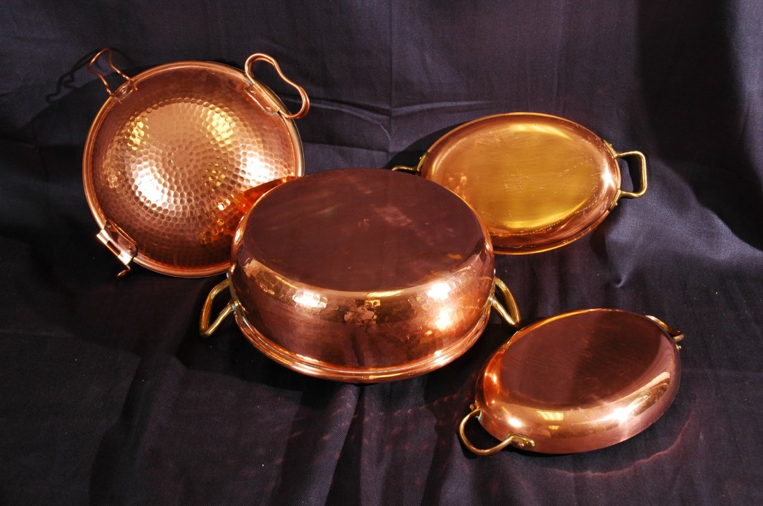 Set of Copper Cookware: Se of Copper Cookware - Four pieces of copper cookware, pots and serving dishes. Pot#1 Stamped Ruffoni Italy, serving dish stamped Tagus Chef made in Portugal.