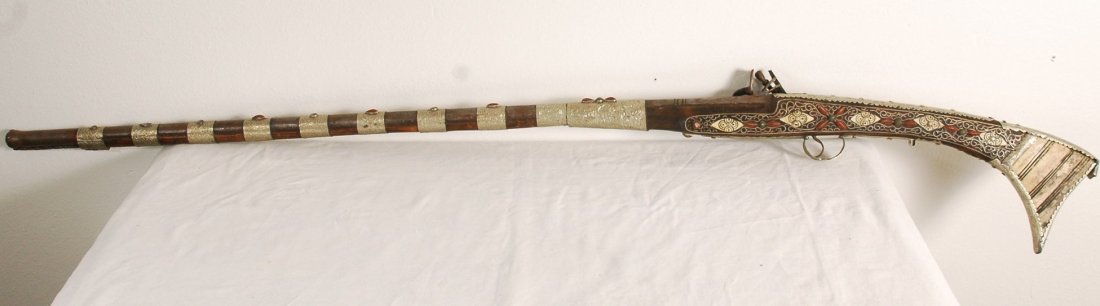Indian Wood Rifle: Beautiful indian wooden rifle with stone and bone inlay. 54"Tall. Some minor rust from age but otherwise in excellent condition.