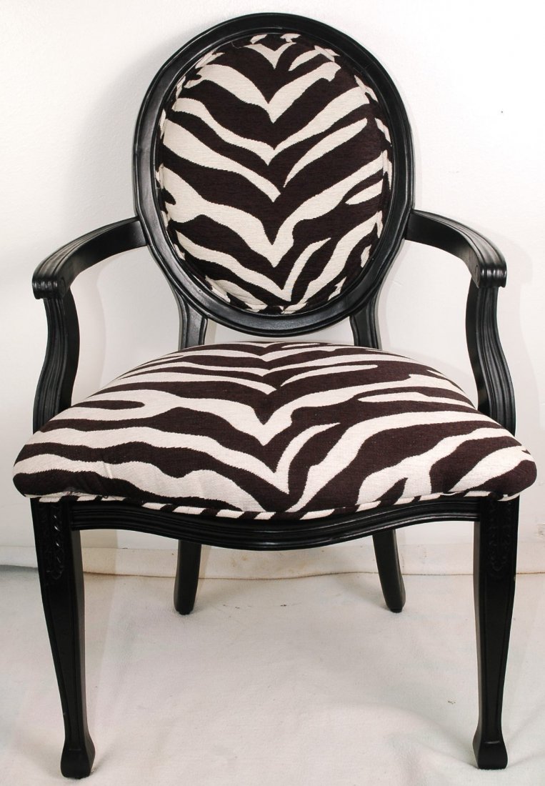 Zebra Striped Chair: Dark wooden chair with black and white zebra striped plush upholstery. 40"H x 27"W