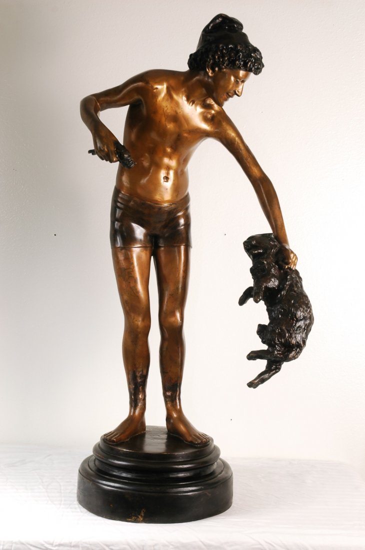 Boy Hunter Bronze 34" Tall: Large bronze statue of a Boy Hunter standing on marble base. Boy is wearing shorts and holding a wild animal in one hand and a bird in the other. 34" tall and 10 wide. Signed by the artist on the base
