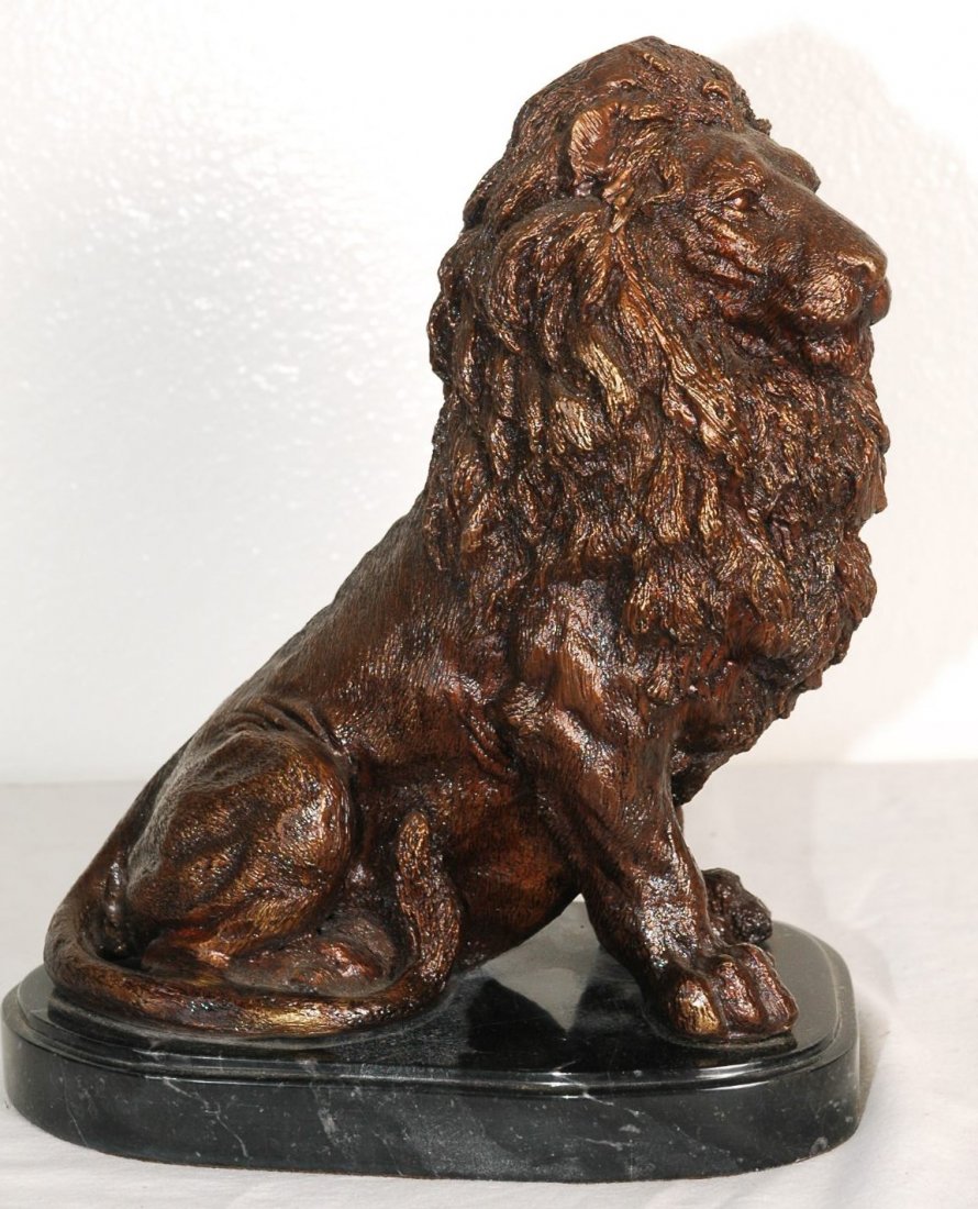 Bronze Lion King: Bronze state of the Lion King posed with full mane. Rests on marble base. 11"H x 7.5"W