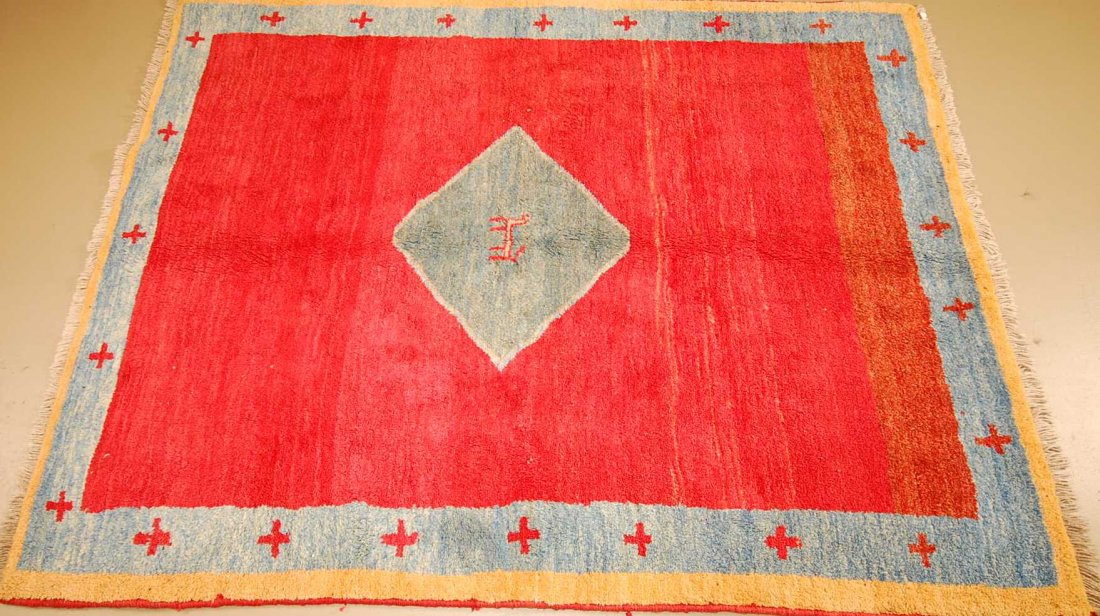 Hand Woven Tribal Nepal Rug 7'4" x 5'10": 5'10" x 7'4" hand woven rug made of wool, with tribal design and geometric red and blue designs and color.