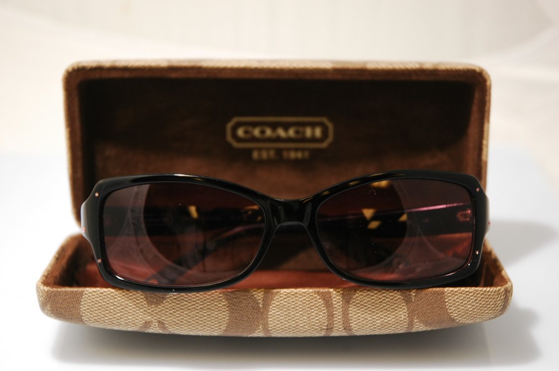 Coach Sunglasses with Case: Genuine Coach sunglasses with black framed accented with pink rhinestones and rose colored lenses. Comes with original Coach case in brown with lens cleaning cloth. Used but in excellent condition.