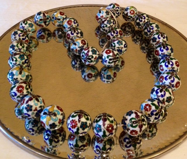 32 Cloisonné Balls Strand: Beautiful white and multicolored cloisonné balls 32 in total each 1" in diameter (RARE size) and strung together on a necklace strand 34" in length.