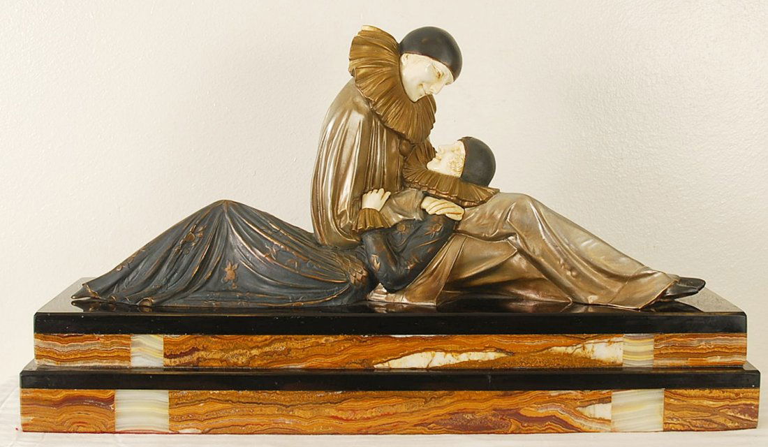 After Demetre Chiparus "Early Story" Statue: After D.H. Chiparus statue of two people in love on large marble stand. Elegant! 29"W x 8"D x 17"H. Made of bronze, ivory and onyx. Signed after D.H Chiparus on marble stand.