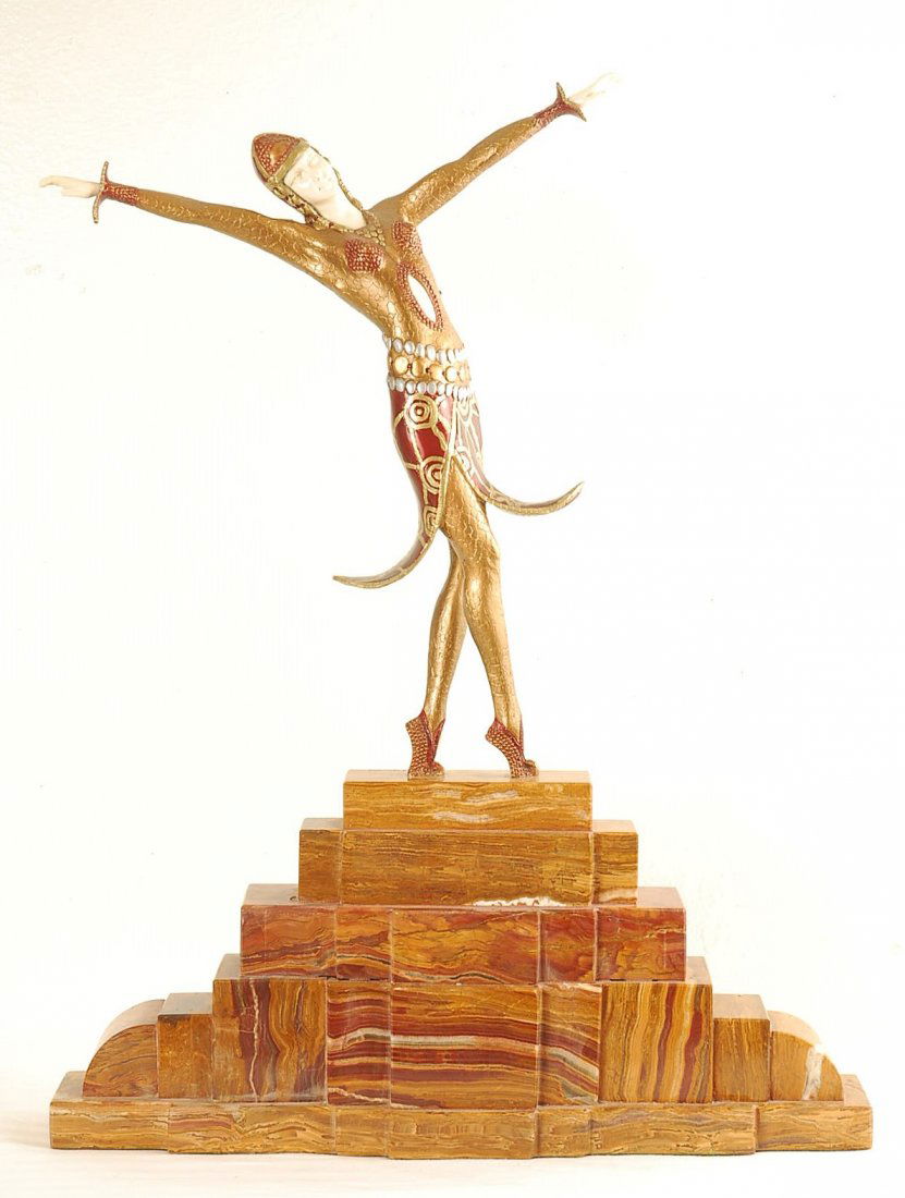 After Demetre Chiparus Statue "Slit Skirt": Bronze, onyx and ivory statue of a woman dancing on a large marble stand. 18.5"W x 3"D x 24"H.