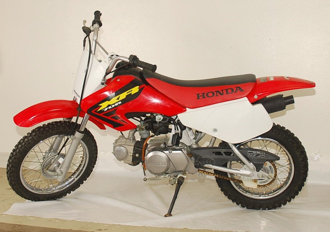 Honda XR 70 R: Honda Dirt bike 2002 model. Red, appears to be in working condition, but not tested to guarantee working condition.