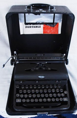 Vintage Royal Portable Typewriter w/ Case: Vintage Royal Portable Typewriter w/ Case excellent condition with original manual included. Case measures approx. 13" wide x 12.75" tall