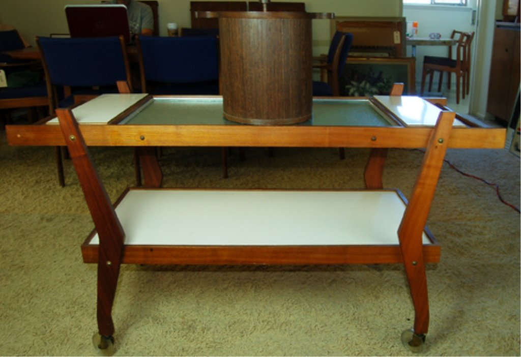 Mid Century Teak Serving Table w/ Warmer: Great custom serving tray Piece with top glass warming implement, the cords cannot be located, but the piece is in excellent condition having solid wood and light ivory Formica. There are also wheels 