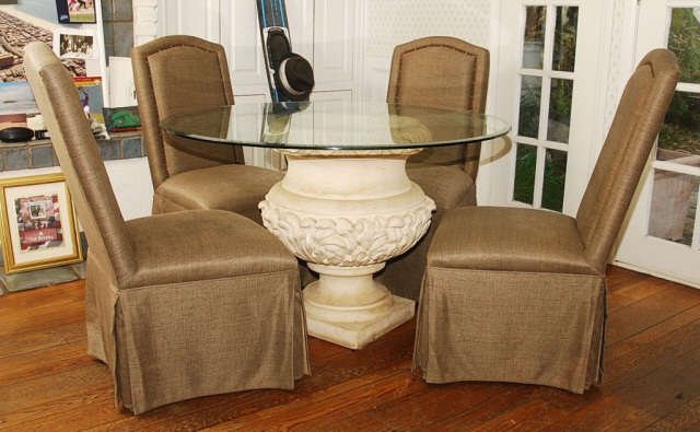 48" Round Glass Top Dinning Table with 4 Chairs: 48" Round Glass Top Dinning Table with 4 skirted Chairs with nail head trim, table base is made out of cement. Scratches to the glass top, otherwise in good condition.