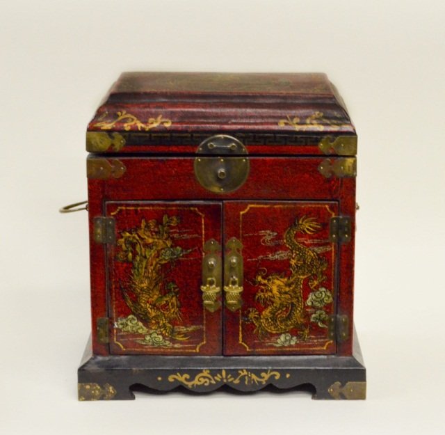 Vintage Chinese Jewelry Box / Chest with Leather S: Vintage Oriental Leather Textured covered jewelry box in a warm red with gold painted and antique brass accents. This piece has two drawers and the top opens with with rice paper lining. Measures appr
