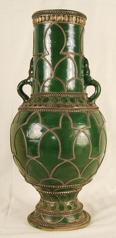 Antique Moroccan Vase: Antique Moroccan Vase. Green glazed ceramic vase with metal artwork. Chip on bottom of base (see last picture) otherwise in good condition. Vase approx 17 inches tall and 9 inches wide.