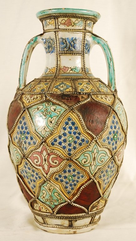 Antique Moroccan Vase: Antique Moroccan Vase. Hand crafted ceramic Moorish style with fine silver nickel metal and leather artwork. Hairline cracks by the lip of vase (as seen on last picture) otherwise in good condition. O