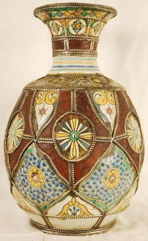 Antique Moroccan Vase: Antique Moroccan Vase. Hand crafted ceramic Moorish style vase with fine silver nickel metal and leather artwork. Bottom inscribed with Arabic characters (pls see last image). Vase approx 19 inches ta