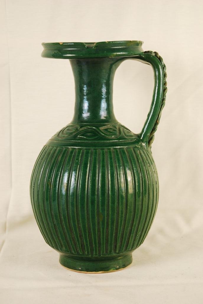 Antique Moroccan Vase: Antique Moroccan Vase. Hand Made. One-of-a-kind glazed green ceramic is in good condition. Small negligible chipping on upper lip of vase (as seen on last picture). Vase approx 12 inches tall and 8 in